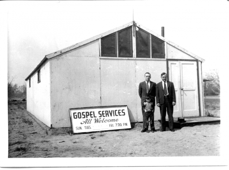 This portable wooden hall was used for gospel meetings
in the mid 1940's in the Los Angeles area, prior to it
being moved to Ontario, CA in 1952-53 for gospel
meetings for the West End of San Bernardino County.
The hall could hold up to 50 people.
For a year, it remained on John VanDermyden's parents
property at 12652 S. Sultana, Ontario, California.
Pictured are: Eldon Tenniswood, John Porterfield
and Donald VanDermyden (boy).
Gospel Meeting Hall-portable.jpg