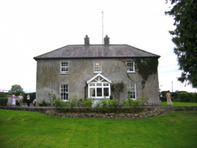 Ashmount, Kill, Rathmolyon, Co. Meath, Ireland
Built in 1872 on land Garrett and Ann Gill were given by her father.
Birthplace of Emma, Paul and Jennie Gill.
In 1862, Willie John Pigott (father) transferred the land to Garrett and Ann (Pigott) Gill.
In 1872, Garrett Gill built the home called Ashmount
In 1897, deeded to eldest son: William John Gill
In 1903, sold to Willie's brother, Philip Henry (Harry) Gill (died February 12, 1961) when Willie entered the work
In 1961, inherited by son, Herbert Norman Gill (no children) (died March 14, 1985)
In 1985, inherited by nephew, John Swanton (current owner)
Irvine held inaugural organization meeting of Workers at Ashmount in 1903 on Willie Gill's property.
Photo taken Aug. 2004.
Ashmount, Rathmolyon, Co. Meath, Ireland Big.jpg